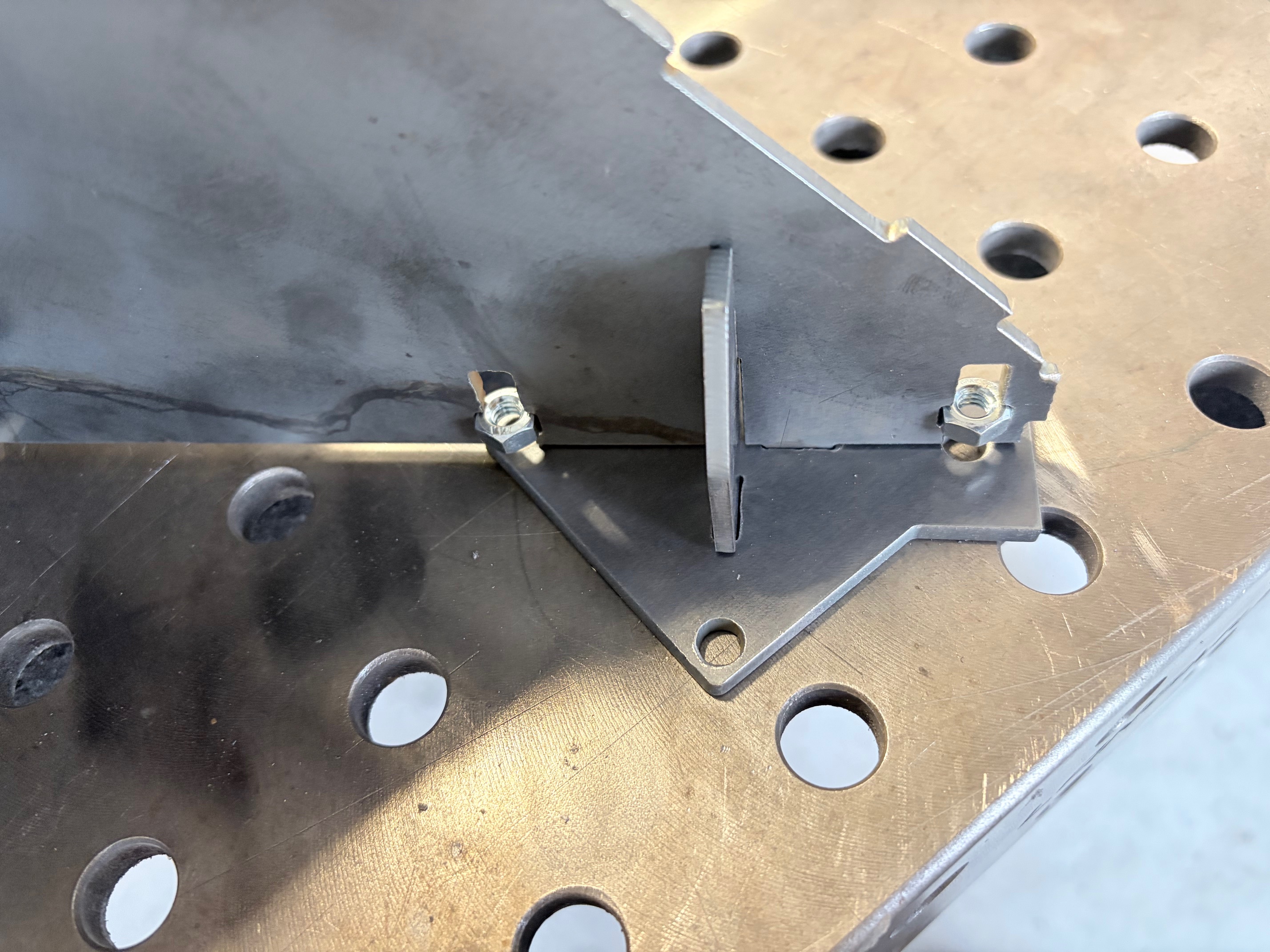 Custom bracket with integrated captured nut hardware design for clean assembly.