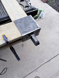 Custom metal fabrication and structural repair work on a shop floor.