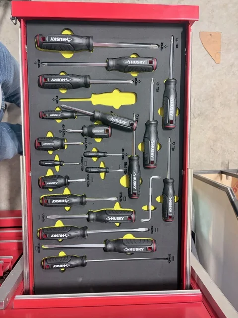 Finished custom screwdriver drawer foam insert with tools loaded in a red toolbox drawer.